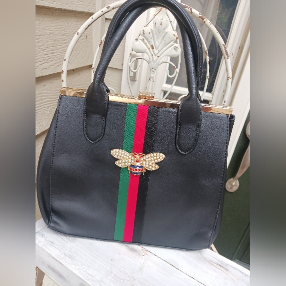 Embellished bee handbag.